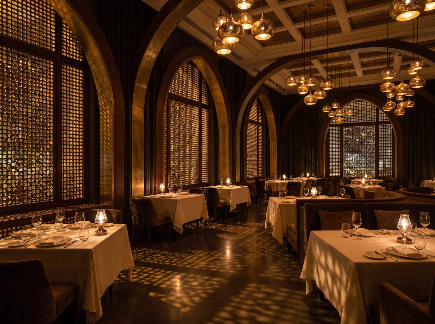 The dining room — arched niches and mashrabiya shadows